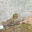 The gutter running around the foot of the gun pit wall of the SW Emplacement, with a circular drain above