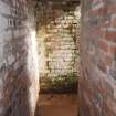 Rhobodach: View NE along the corridor on the SE side of the air raid shelter leading towards the external entrance