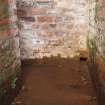 Rhobodach: The small cable duct at floor level leading from the corridor through to the SE corner of the air raid shelter