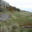 View of the barracks (9.36) from the WNW with the two buildings to the N (9.34, 9.33) on the terraces above 