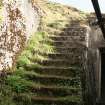 W Emplacement: The flight of steps leading down to the basement from the gun platform 
