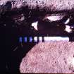 Excavation photograph, Massive flint core in-situ. Section through plough furrow with scale, Nethermills