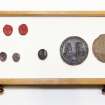 View showing contents of fourth drawer from the top of cabinet containing intaglios and wooden plaques.