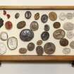 View showing contents of sixth drawer from the top of cabinet containing intaglios and wooden plaques.