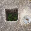 A square socket and a metal plate on the upper surface of the concrete block that supported the radio mast 