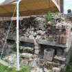 Watching brief, View of lapidarium wall after stone removal, Coldingham Priory