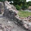 Watching brief, View of refectory wall prior to removal of loose facing, Coldingham Priory