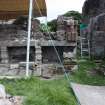 Watching brief, View of lapidarium wall after removal of fonts, Coldingham Priory