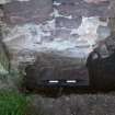 Watching brief, View of sandstone block below present ground surface, Coldingham Priory