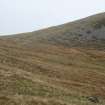 View NE showing the dyke below the scree slopes of Ard Nev.