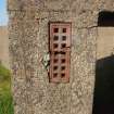 An air brick in the upper corner of an ammunition locker