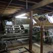Islay, Bridgend/Redhouses Woollen Mill. Interior, first floor.  View of Warping Machine. The yarn is guided by the frame of the 'creel' on the right onto the machine in yarn order.