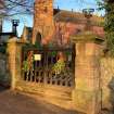 View of main gate to church and churchyard from the SW.