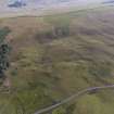 Oblique aerial view of Normangill 2 unenclosed platform settlement and cairnfield