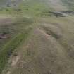 Oblique aerial view centred on the burial cairn, Fall Hill