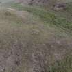 Oblique aerial view centred on the burial cairn, Fall Hill