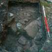 Archaeological evaluation, Test Pit 1 cobbled surface (103) and wall (105), 126-128 High Street, Dunbar