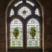 Hospital Chapel. Detail of stained glass window of foliage by Douglas Strachan flanking the central Good Samaritan window in memory of Dr William Lauder Lindsay. 
