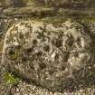 View of cup and ring marked stone below east window. Photographed with flash.