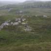 View from S showing location below an outcrop.