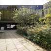 View of north east facade and landscaped garden, showing path from car park to garden, from north east.