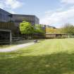 View of landscaped grounds showing building's relationship to surrounding landscape, from south west.