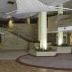 Sub-basement.  Restaurant. View of main space showing staircase from basement level and to mezzanine, and flower beds.