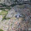 Oblique aerial view of the housing development around Letham Mains Primary School, Haddington.