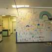 Main block. East Wing First floor. Ward 3. View of wall with written farewell messages and drawings. 