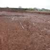 Excavation photograph, Furrow 4 looking E. The disturbed stones removed, new Mearns Academy site, Laurencekirk, Aberdeenshire 