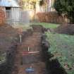 Evaluation photograph, Trench 1 looking N with feature 4 in foreground, Proposed play area, Brodie Castle, Moray