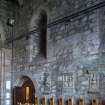 View of west wall with arched recesses and stone monuments in  St John's, the Oil Chapel (North Transept) 