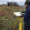 Ms A McCaig and Mr D Bratt surveying hut circle. View from E.