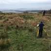 Ms A McCaig and Mr D Bratt surveying hut circle. View from E.