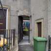 View from south-east showing detail of stone arch and pend between No 2 High St and No 1 Kirk Wynd, Clackmannan