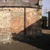 Historic Building Survey photograph, Direction facing E, Building C, West elevation south end showing red sandstone wall fabric of building I incorporated in the wall, Goshen Farm
