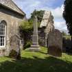 View of arched window, monument and burial aisle from southwest