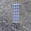 Detail of arched window on east gable