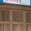 Detail of carved reredos screen with inscription