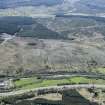 Oblique aerial view.  This is one of a series of photographs of changing forestation patterns along the course of the M74 between Crawford and Kirkpatrick-Fleming.