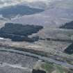 Oblique aerial view. This is one of a series of photographs of changing forestation patterns along the course of the M74 between Crawford and Kirkpatrick-Fleming.