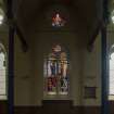 View from west of east arcade and Stained Glass window by Douglas Strachan of Crucifixion with Moses and the Brazen Serpent 1901-2