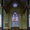 View from east of west arcade and Stained Glass window by Douglas Strachan of Supper at Emmaus 1940's