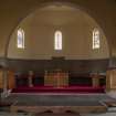 Interior view of Apse and platform with pulpit, font communion table and lecturn.