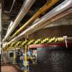 Interior. Brewhouse, ground floor, Copper House.View of fireboxes below gas-fired copper vessels on the floor above.