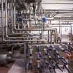 Interior. Brewhouse, ground floor, Fermentation Room area. View of flow plate in Yeast Storage Tanks area