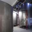 Interior. Racking and Conditioning area. View of 'CRT' tanks holding beer run off from the Fermentation Tanks, ready to be racked into casks on the floor below. The beer is conditioned in the cask.