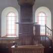 Detail of communion table, arched windows and pulpit with domed sounding board