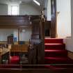 View of pulpit stairs, pulpit and communion table from west
