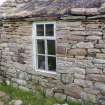 Detail of NE window in NW wall of cottage